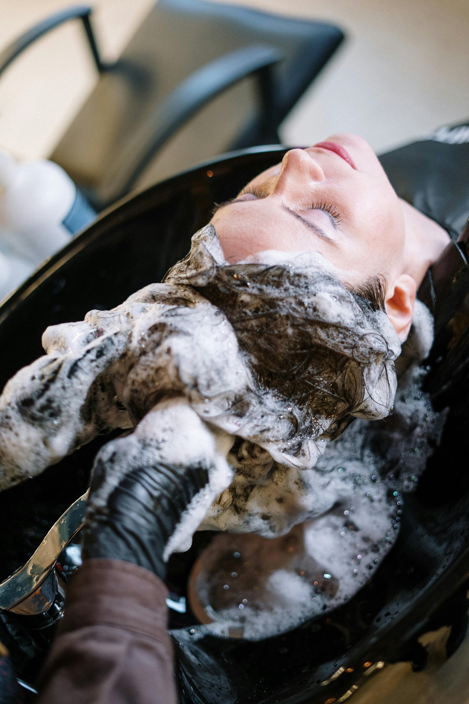 Luxtrous Luxe hair care collection, featuring premium shampoos, conditioners, and treatments, beautifully arranged with soft lighting to highlight their sleek packaging and nourishing ingredients, providing a luxurious hair care experience.